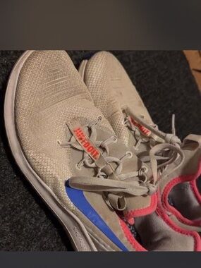 Running Shoes with Blue Swoosh and Pink Trim